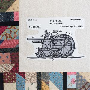 A drawing of a potato digger and its parts.
