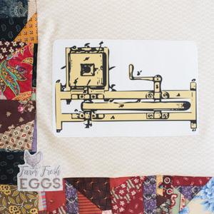 A drawing of an egg beater machine.