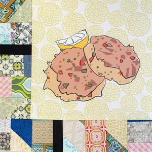 Two patties and a lemon wedge.