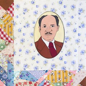 Eugene Allen in a brown suit.