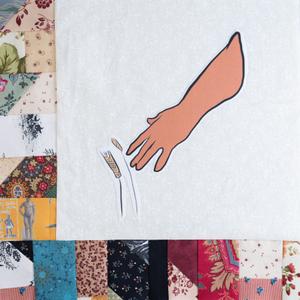 A hand grabbing for grains.