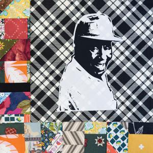 Booker T Whatley smiling in a baseball cap.