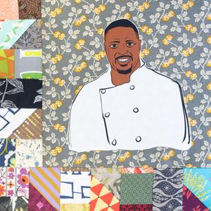 Maxcel Hardy smiling in a white chef coat.