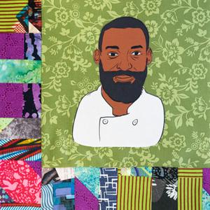 Eric Adjepong in a white chef coat.