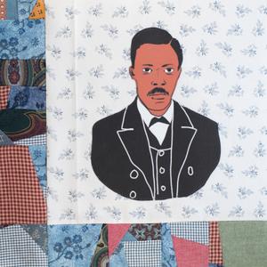 George Crum in a black suit.