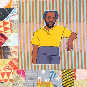 Tunde Wey smiling in a hat and apron.