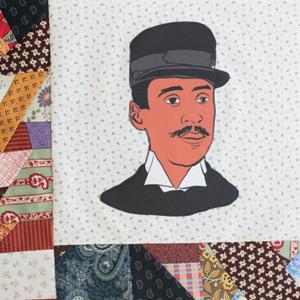 An African American man with a black hat.