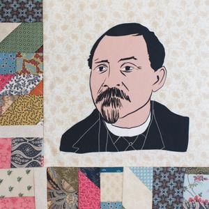 Barney Lancelot Ford in a black coat and suit.