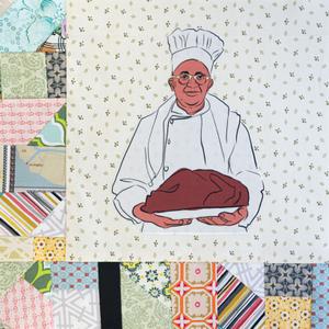 Carson Gulley in a white chef coat and hat holding a dish of food.