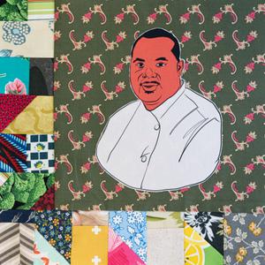 Bernard Carmouche in a white chef coat.