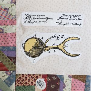 A drawing of an ice cream scoop and its parts.